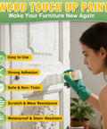 Woman applying White Touch Up Paint For Wood And Household Fixes, 6.35 Oz Water Based All In One Repair Gel on cabinet.