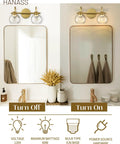 Gold Finish 15 Inch Two Light Vanity Light With Clear Globe Glass Shades Dope Modern Steel Bath Fixture showing on and off view above mirrors