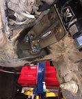Death Grip Idler Side Package For GM Heavy Duty Trucks 2011 To 2024 2500HD 3500HD Includes Idler Arm Idler Support And Gusset Housing Machined From Solid Billet Steel Heat Treated 4140 Chromoly Stud installed under truck