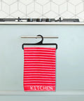Red striped towel hanging on black plastic hanger from set of 50 black plastic hangers for home and retail display in kitchen