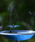 Solar Powered Circle Fountain Pump 1.4W With 6 Nozzles Floating Garden Water Pump Kit in a bird bath with pigeons.