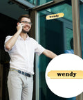 Clear 8 Inch Acrylic Name Plate Holder 2x8 Inch Wall Sign Display Pack of 20 with Sticky Tape shown on glass door