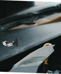 Elastic Rubber Hood Latch Kit For Vehicles with shock absorption installed on black engine cover
