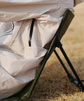 Side view of Ultra Lightweight Outdoor Camping Backrest Chair With Carry Bag For Park Vibes And Beach Days in use on grass