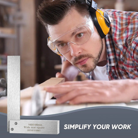 Machinist Square Set 2 Inch 3 Inch 4 Inch And 6 Inch Squares used by engineer with safety glasses and earmuffs in workshop.