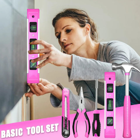 Woman using Pink Tool Set For Women 130 Piece Home Toolkit including level, pliers, screwdriver, and hammer.