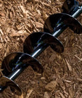 Spiral Bulb Planter Auger Tool For Planting Bulbs Seedlings And Tulips In Beds And Pots 3 By 7 Inch Fast Hole Digger close-up in soil