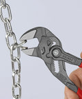Seven And A Quarter Inch Pliers Wrench With Smooth Jaws And Black Finish, gripping a metal chain, showcasing tool use.