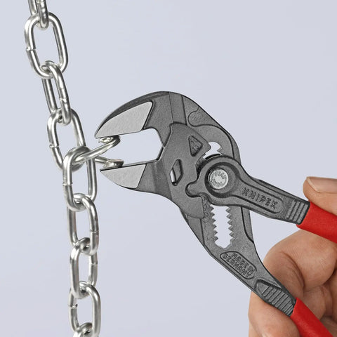Seven And A Quarter Inch Pliers Wrench With Smooth Jaws And Black Finish, gripping a metal chain, showcasing tool use.