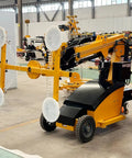 Electric Hydraulic Robot Glass Lifter With Kickass Suction Grips For Heavy Marble Slabs And Big Glass Panels. Heavy-duty, yellow construction equipment.