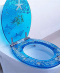 Heavy Duty Resin Toilet Seat With Lid Boasting Vivid 3D Ocean Details And Smooth Shell Motifs Soft Close Bath Accessory Breeze Install For Universal Oval Designs, featuring blue ocean graphics and soft close mechanism.