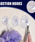 Super Strong Suction Cup Hooks For Bathroom Wall 10 Pack on tile, holding bath accessories like loofah and towel.