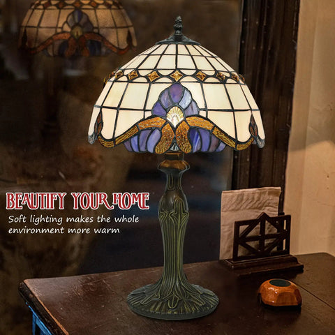 Vintage Tiffany Style Glass Table Lamp with eye-catching shade on wooden nightstand, warm light illuminating cozy room decor