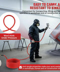 Person using 50 Ft Hybrid Air Hose For Compressors And Tools, 3/8 Inch Air Hose, 300 PSI Rating, all-weather flexibility in workshop