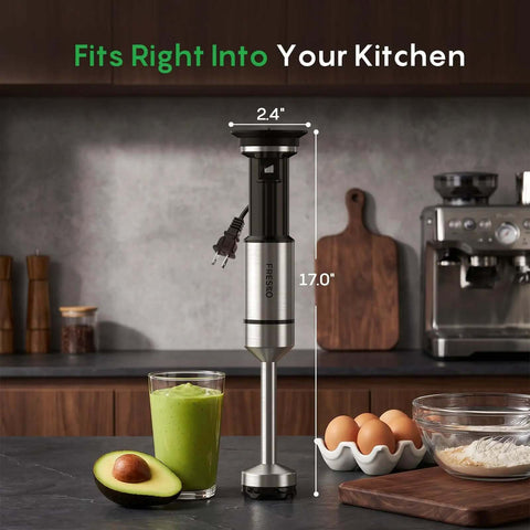 Total Game Changer Handheld Immersion Blender With Titanium Coated Blades And Variable Speed Trigger next to smoothie and avocado.