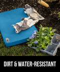 Extra Thick Supportive Foam Kneeling Pad 2 Pack on soil with gardening gloves and flowers, dirt and water resistant.