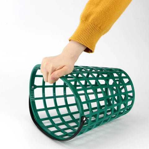 Hand holding durable ABS golf ball basket with handle, part of a Two Pack Golf Ball Basket With Handle Made From Durable ABS Non Rolling Flat Sided Ball Holder