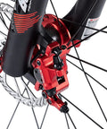 Red XTECH aluminum alloy hydraulic disc brake caliper, front view on MTB fork with rotor visible