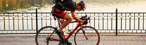 Cyclist on road bike using Assioma Uno Upgraded Single Sided Power Meter Pedals Waterproof With Left Power Sensor by lake