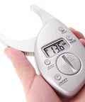 Portable Skinfold Caliper With LCD Screen For Easy Body Fat Measurement, Handheld Fitness Tool For Men And Women in hand
