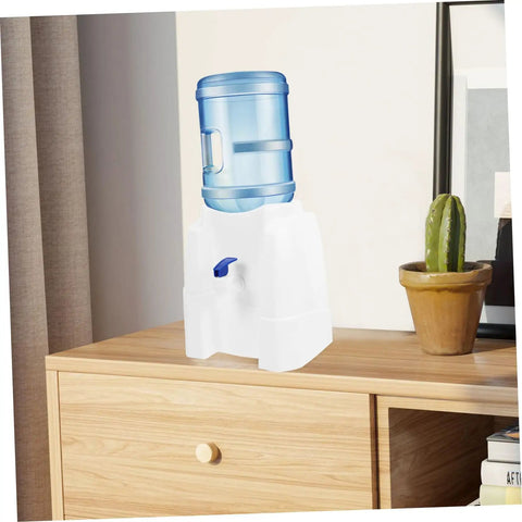 Portable Cold Water Dispenser With Built In Tap Compact Countertop Water Dispenser for office or dorm use on a wooden table.
