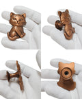 Hella Adorable 3D Sitting Cat Cabinet Knobs Four Pack Vintage Metal Drawer Pulls For Kitchen Cabinetry Upgrades With Embossed Fur Texture And A Super Chill Vibe To Liven Up Your House Today, bronze cat shape knob held in gloved hand.
