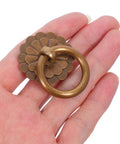 Close-up of a vintage-style brass ring pull handle, part of the Six Pack Vintage Style Brass Drawer Knobs and Ring Pull Handles Set for Cabinets.