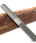 Workhorse 4 In 1 Wood Rasp File 8 Inch Straight Shooting Shaping Tool resting on wood, showcasing tough steel construction.