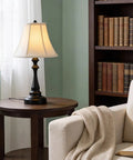 Three Piece Vintage Style Lamp Set With Bronze Finish And Brown Fabric Shades Includes Two Table Lamps And One Floor Lamp on table
