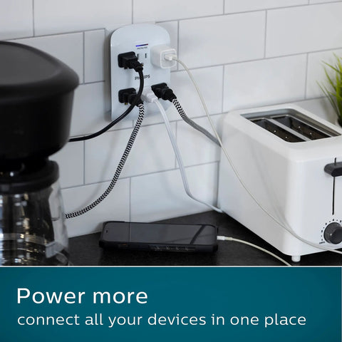 Kitchen counter with Six-Outlet Surge Protector Wall Tap with 900 Joules, powering toaster, phone, and coffee maker; white finish.