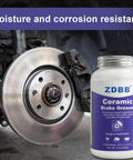 Ceramic Brake Lubricant For Caliper Pins High Temp Synthetic Brake Lube With Moisture Proof Formula 8Oz Brush Top shown next to car brake system