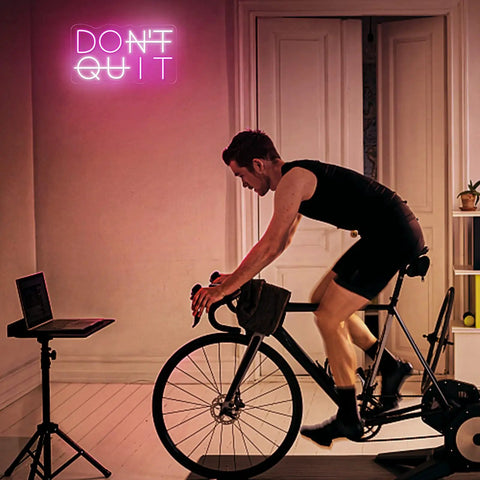 Dont Quit Neon Sign Do It LED Neon Light for Wall Decor USB powered lighting in gym with cyclist, pink white acrylic
