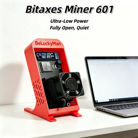 Open Source Bitcoin Miner 1.2 THs Quiet Home Solo Mining Rig With BM1370 ASIC Ultra Low 18W Power 2.4G WiFi Easy Setup Includes Power Supply And Red Stand For Education Or DIY Mining. Red Bitaxes Miner 601 on desk with laptop, fan and OLED screen