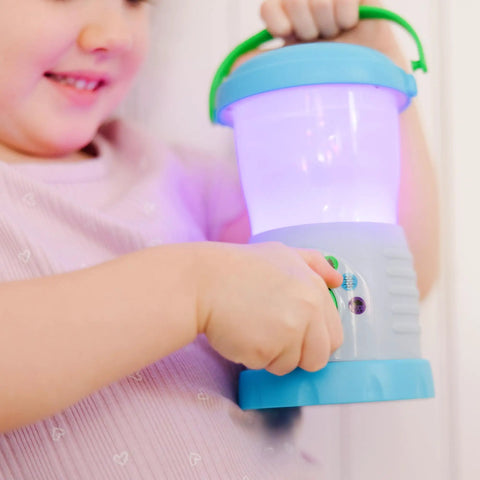 Child holding Durable Light And Sound Camping Lantern Toy with six color modes and sound effects.