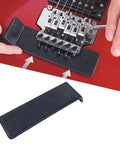 Slick Floating Tremolo Setup Blocks And Hella Smooth Sliders For Floyd Rose Electric Guitars with adjustment tool in use on red guitar.