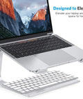 Detachable Aluminum Laptop Stand For Desk, Ultra Stable Mount Fits 10 To 16 Inch Laptops Like MacBook Air Pro Dell HP And More, Easy Setup, Sleek Silver Finish For Better Posture And Cooler Work Sessions, holds a laptop above a keyboard