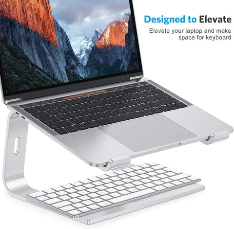 Detachable Aluminum Laptop Stand For Desk, Ultra Stable Mount Fits 10 To 16 Inch Laptops Like MacBook Air Pro Dell HP And More, Easy Setup, Sleek Silver Finish For Better Posture And Cooler Work Sessions, holds a laptop above a keyboard