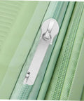 4 Pack Zipper Repair Kit For Luggage And Gear, Universal Zipper Pull Replacements close-up installed on green luggage