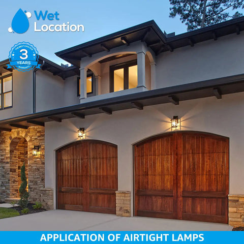 Front of house with garage doors lit by dimmable vintage Edison LED bulbs 7W filament, suitable for wet locations.