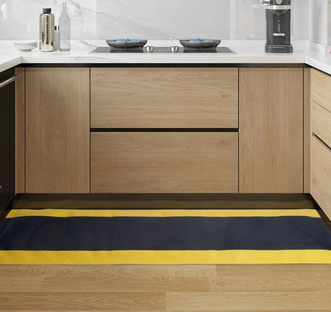 Anti Fatigue Floor Mat For Garage And Workshop Shop 20x60 Inch Ergonomic Standing Mat With Bright Safety Yellow Border Heavy Duty PVC Foam Cushion To Relieve Foot And Back Pain While You Work All Day installed in a kitchen setting