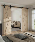 Heavy Duty Sliding Barn Door Hardware Kit For 60 Inch Wide Double Doors, 20 foot track, installed in a modern bedroom.