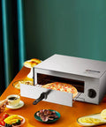 Stainless Steel Countertop Pizza Oven With Auto Shut Off, 12 Inch Capacity, 360 Degree Heating, on kitchen counter in use