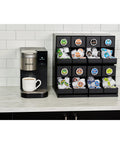 8 Count Modular Coffee Pod Merchandiser for Commercial Use - Slim, Gravity-Dispense Design next to Keurig coffee maker