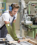 Man using woodworking tools wearing Top Shelf Kevlar Arm Sleeves With Thumb Holes Cut Scratch And Heat Resistant Long Arm Protective Guards.