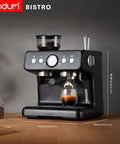 Premium Game Changer Electric Espresso Machine With Integrated Stainless Steel Burr Grinder And High Pressure Milk Frother Steam Wand For Straight Up Barista Style Brewing At Home In Classic Black, side view showing grinder and espresso.