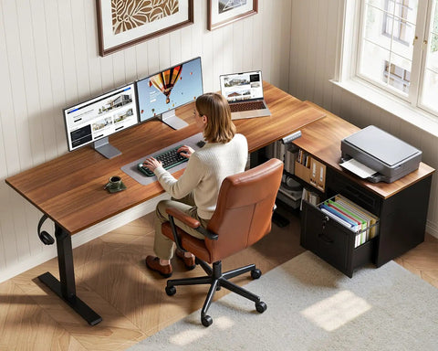 Person working at 55 Inch L Shaped Electric Standing Desk With Drawers And File Cabinet Sets For Home Office Sit Stand Computer Desk In Walnut And Black