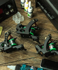 Four Coil Tattoo Machine Kit Set For Lining Shading And Coloring With Power Supply Foot Pedal Cartridges And Color Pack on table