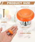 Two Pack Ceramic Cabinet Knobs 1.4 Inch Round Drawer Pulls With Mounting Screws Dope Modern Orange Cabinet Hardware displayed on hand