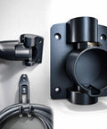 Badass Wall Mount J1772 EV Charger Holder Boasts A Slick Swivel To Clear Floor Space In Tight Garages Locks Type 1 Sae Plugs installed on wall.