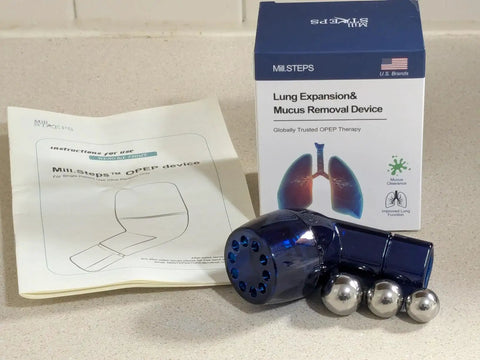 Mucus Clearing Lung Exerciser With Flutter Valve And Expiratory Trainer, device with box and instructions on countertop